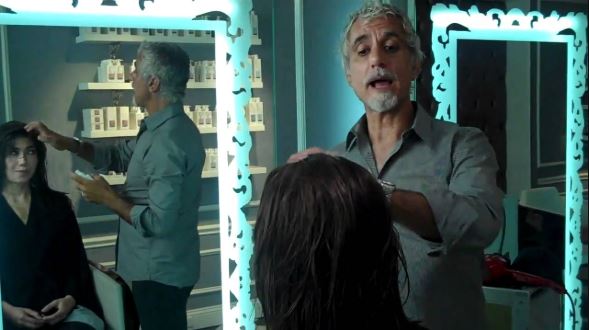 Ric Pipino styling his client hair in his salon